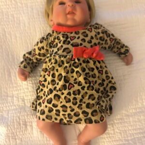 Charming Leopard Print Doll with Red Bow